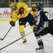 Michigan freshman defenseman Jacob Trouba gets rid of the puck in the first period of the game against Michigan State on Friday. Daniel Brenner I AnnArbor.com
